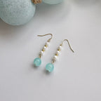 Coastal blue pearl drop earrings with gold huggie hoops and freshwater pearl accents